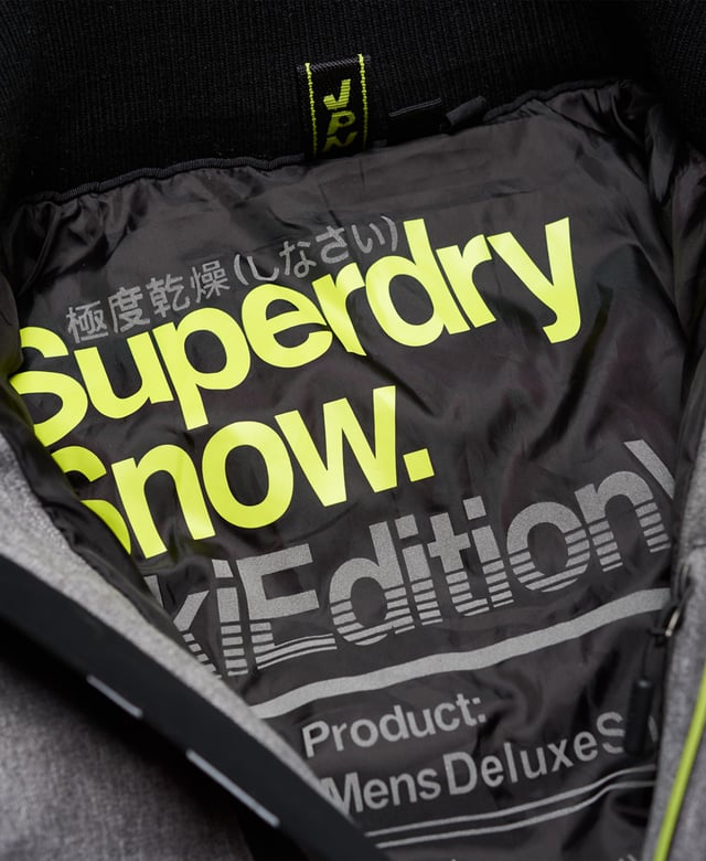 Superdry men’s Deluxe Nordic snow puffer jacket. This padded weather tolerant jacket with an inner ribbed collar, detachable hood with a removable faux fur trim and a taped seam zip fastening is perfect for hitting the slopes in. The Deluxe Nordic snow puffer jacket features five outer pockets – one with a detachable goggle cloth, hook and loop fastened cuffs with thumbholes and zip fastened armpit ventilation. Inside, the jacket has a removable snow skirt and a single internal pocket with earphone routing. The jacket is finished with Superdry branding on the zips, placket, shoulder and arms. Water resistance  10,000mm 
Breathability  10,000g
Snow seals and coated zipsModel wears: Medium Model height: 6’ 1” (185cm) Model chest size: 38" (96cm)