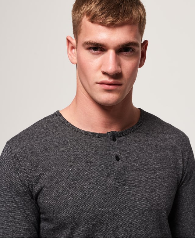 Superdry men's SD Laundry organic cotton grandad top. This luxuriously soft top is perfect for lounging in, featuring a button down fastening and long sleeves. This grandad top is completed with a Superdry logo patch above the hem. Wear with a pair of our super soft joggers for the ultimate comfortable attire.Made using cotton grown using organic farming methods which minimise water usage and eliminate pesticides, maximising soil health and farmer livelihoods.