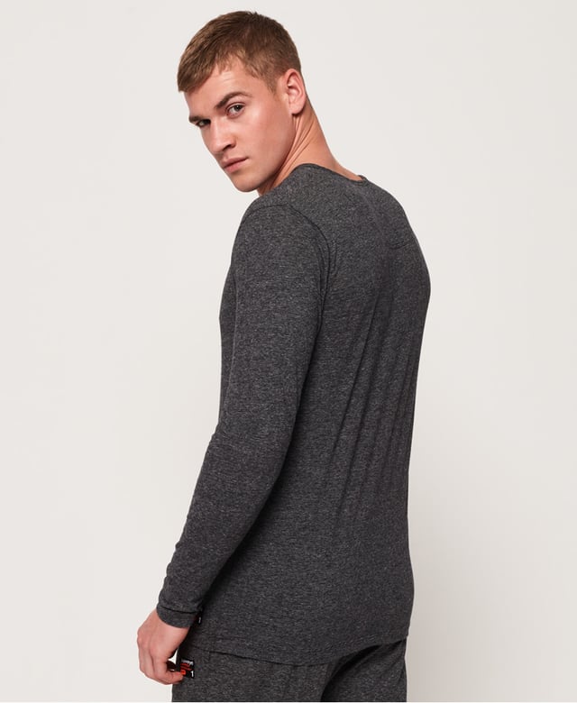 Superdry men's SD Laundry organic cotton grandad top. This luxuriously soft top is perfect for lounging in, featuring a button down fastening and long sleeves. This grandad top is completed with a Superdry logo patch above the hem. Wear with a pair of our super soft joggers for the ultimate comfortable attire.Made using cotton grown using organic farming methods which minimise water usage and eliminate pesticides, maximising soil health and farmer livelihoods.