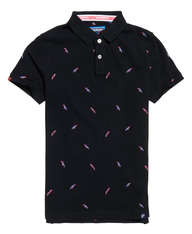 Superdry men's Bermuda polo shirt. This classic style polo shirt features short sleeves, two button fastening and an all over embroidered pattern. Finished with a Superdry logo tab on the hem and on one sleeve. Will look great with a pair of jeans or shorts and trainers this season.
