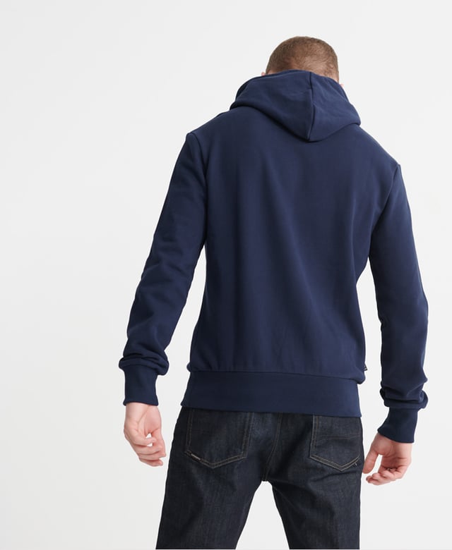 Superdry men's Super 5's loopback hoodie. This overhead hoodie features a classic drawstring hood, a large front pouch pocket and ribbed hem and cuffs. Finished with a printed Superdry logo on the chest , an all over print on the inside of the hood and a Superdry logo tab on one side seam.Slim fit