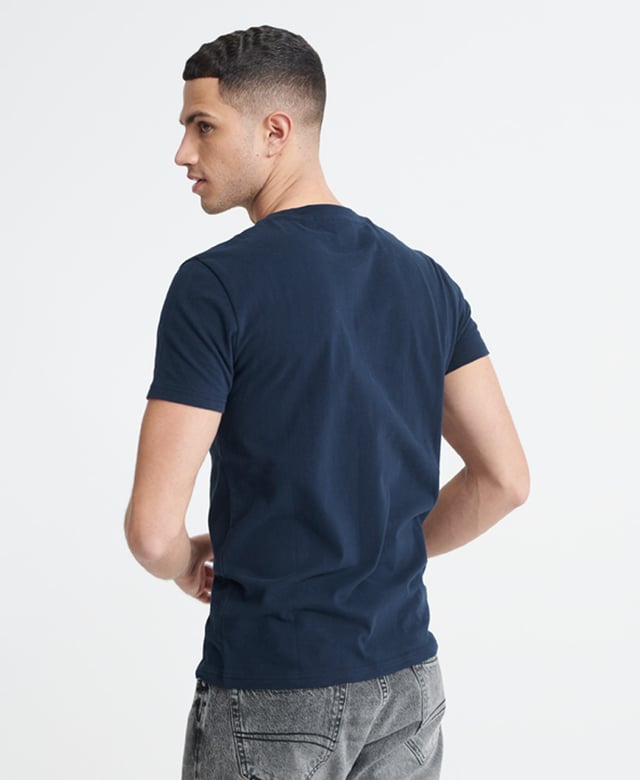 Superdry men's Neon classic t-shirt. A crew neck tee featuring short sleeves, and a textured neon Superdry print across the chest. Pair with jeans for a casual look with a neon twist.