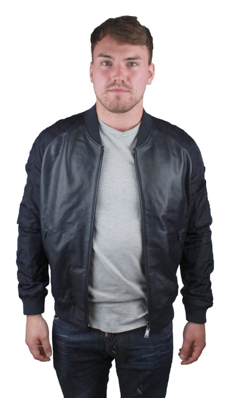 Emporio Armani W1B54P W1P58 0011 Leather Jacket. Black Leather Jacket. Two Way Central Zip Closure. Elasicated Waist and Sleeve Endings. Polyester Arms With Camo Print. Branded Badge on Left Shoulder