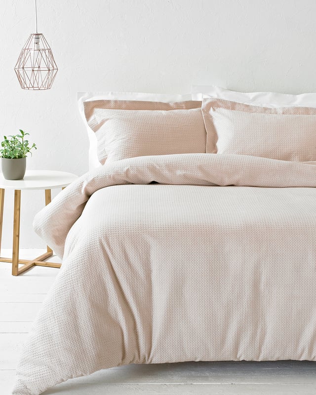 The Waffle duvet set is made of 100% soft cotton, woven on a loom making it a very durable fabric. It’s unique three dimensional design gives it a large surface area to keep you snug and warm on cold evenings while also being breathable for warmer weather. This full bodied duvet set comes with large matching pillowcases complete with an oxford border for that extra touch of luxury. The duvet cover set has a secure button closure while the pillowcases feature a simple envelope closure to keep your pillow safely in place. For the best finish machine wash at 40 degrees. Tumble dry on a low setting and use a hot iron.