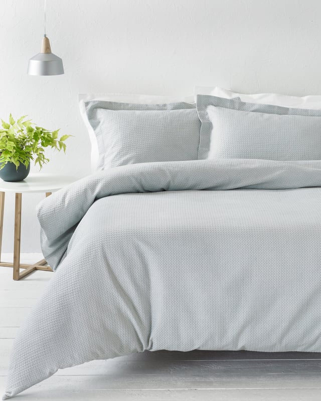 The Waffle duvet set is made of 100% soft cotton, woven on a loom making it a very durable fabric. It’s unique three dimensional design gives it a large surface area to keep you snug and warm on cold evenings while also being breathable for warmer weather. This full bodied duvet set comes with large matching pillowcases complete with an oxford border for that extra touch of luxury. The duvet cover set has a secure button closure while the pillowcases feature a simple envelope closure to keep your pillow safely in place. For the best finish machine wash at 40 degrees. Tumble dry on a low setting and use a hot iron.