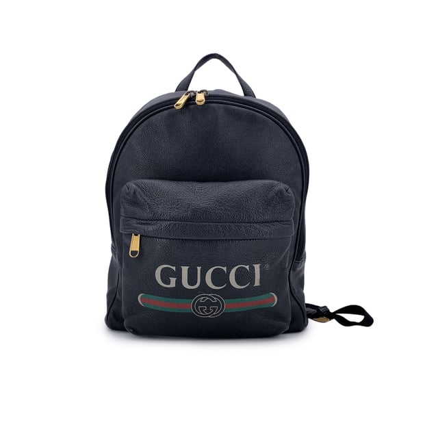 VINTAGE, RRP AS NEW
This beautiful Bag will come with a Certificate of ity provided by Entrupy. The certificate will be provided at no further cost  Elevate your daily style with this functional yet luxurious Gucci backpack. Crafted from rich black leather, this versatile piece is the perfect combination of sleek design and practicality. The front pocket, subtly accented with a vintage Gucci logo, adds a touch of heritage to the modern silhouette, making it an iconic statement for those who appreciate refined craftsmanship.  The zipper closure opens to reveal a spacious interior lined in beige fabric, offering plenty of room for your essentials-whether you're heading to work, running errands, or embarking on travel adventures. For added organization, the interior also features a side zip closure pocket, perfect for keeping smaller items secure. The adjustable shoulder straps ensure a customizable fit for ultimate comfort, making it the ideal companion for your daily commutes or getaway escapes. With its timeless appeal and effortless elegance, this Gucci backpack brings a touch of luxury to every journey. 'Gucci - Made in Italy' tag inside (with serial number on its reverse).    Condition Rating: B - VERY GOOD CONDITIONCondition Details: Gently used. Some stains on the internal lining. Some wear of use on bottom corners. Please check the photos carefully and ask if you need to know more details or if you have any doubts.Measurements (cm):Depth: 17.8Height: 38.1Length: 34.3Other Details: Dustbag? NoKeys? NoBox? No Measurments:  width: 178 mm length: 343 mm height: 381 mm