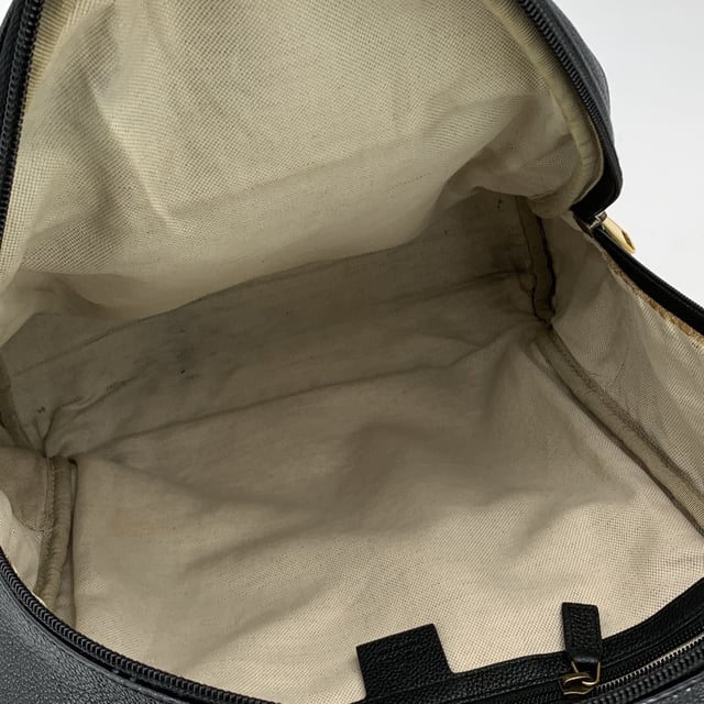 VINTAGE, RRP AS NEW
This beautiful Bag will come with a Certificate of ity provided by Entrupy. The certificate will be provided at no further cost  Elevate your daily style with this functional yet luxurious Gucci backpack. Crafted from rich black leather, this versatile piece is the perfect combination of sleek design and practicality. The front pocket, subtly accented with a vintage Gucci logo, adds a touch of heritage to the modern silhouette, making it an iconic statement for those who appreciate refined craftsmanship.  The zipper closure opens to reveal a spacious interior lined in beige fabric, offering plenty of room for your essentials-whether you're heading to work, running errands, or embarking on travel adventures. For added organization, the interior also features a side zip closure pocket, perfect for keeping smaller items secure. The adjustable shoulder straps ensure a customizable fit for ultimate comfort, making it the ideal companion for your daily commutes or getaway escapes. With its timeless appeal and effortless elegance, this Gucci backpack brings a touch of luxury to every journey. 'Gucci - Made in Italy' tag inside (with serial number on its reverse).    Condition Rating: B - VERY GOOD CONDITIONCondition Details: Gently used. Some stains on the internal lining. Some wear of use on bottom corners. Please check the photos carefully and ask if you need to know more details or if you have any doubts.Measurements (cm):Depth: 17.8Height: 38.1Length: 34.3Other Details: Dustbag? NoKeys? NoBox? No Measurments:  width: 178 mm length: 343 mm height: 381 mm