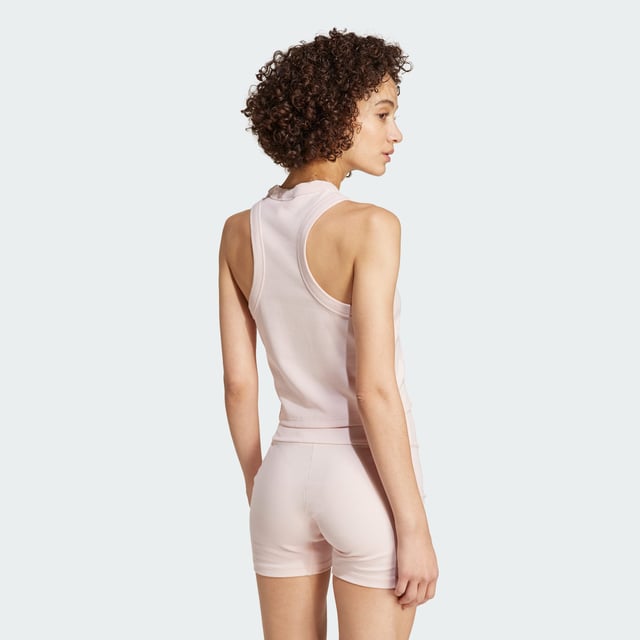 Whether you're spending the day at home or meeting friends for brunch, this adidas tank top lets you move comfortably. Made from stretchy cotton blend fabric, it hugs your shape while side slits provide a gentle fit at the waist. Subtle embroidery adds a stylish touch to this otherwise minimal look.By choosing recycled, adidas are able to reuse materials that have already been created, which helps to reduce waste. Renewable materials choices will help us to remove our reliance on finite resources. Our products made with a blend of recycled and renewable materials feature at least 70% total of these materials.  - This model is 176 cm and wears a size S. Their chest measures 83 cm and the waist 61 cm. - Tight fit - Crewneck - 45% cotton, 45% viscose, 10% elastane - Stretchy bodyhugging fabric - Side slits - Embroidered details - Contains a minimum of 70% recycled and renewable content  Shipped by adidas