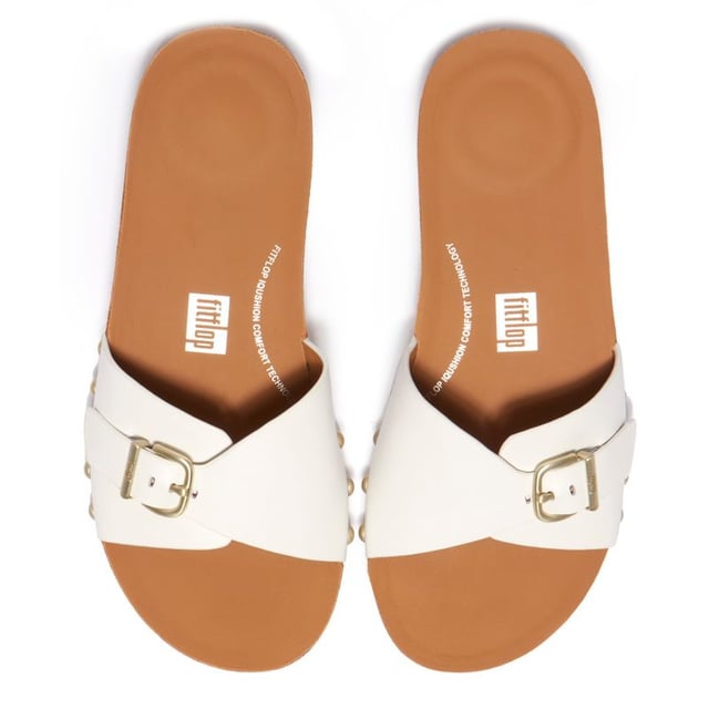 This Fitflop Sandal features a new one-strap design with an adjustable buckle and eye-catching studs to the side. They are a must-have for the warm days to come, holidays and your day-to-evening outfits. Stylish, yet oh so comfortable, these slides are crafted from soft leather with a cork sole gripping outsole. With these sandals are you accessorised and ready to go.