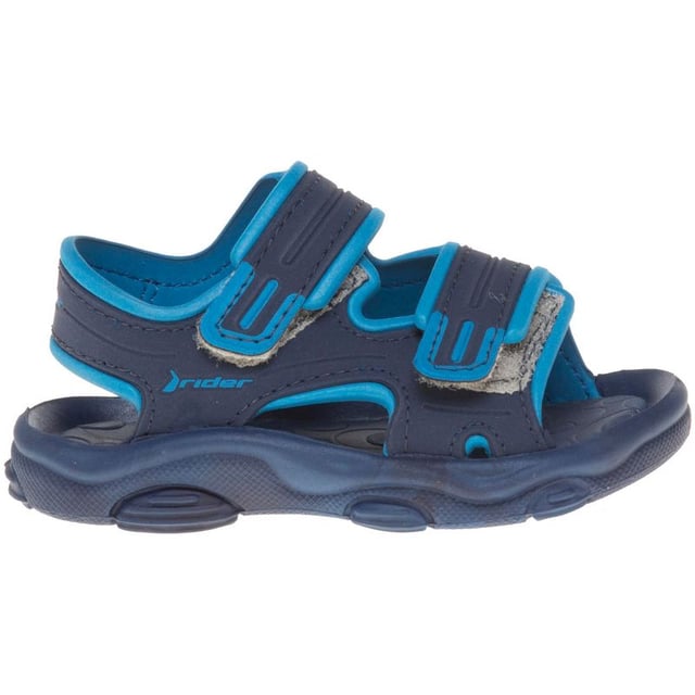 Cuida los dedos de los pies pequeños esta temporada con la sandalia Baby RS2 de Rider. Este zapato de verano azul cuenta con correas de velcro para un ajuste perfecto y una plantilla acolchada para mayor comodidad.