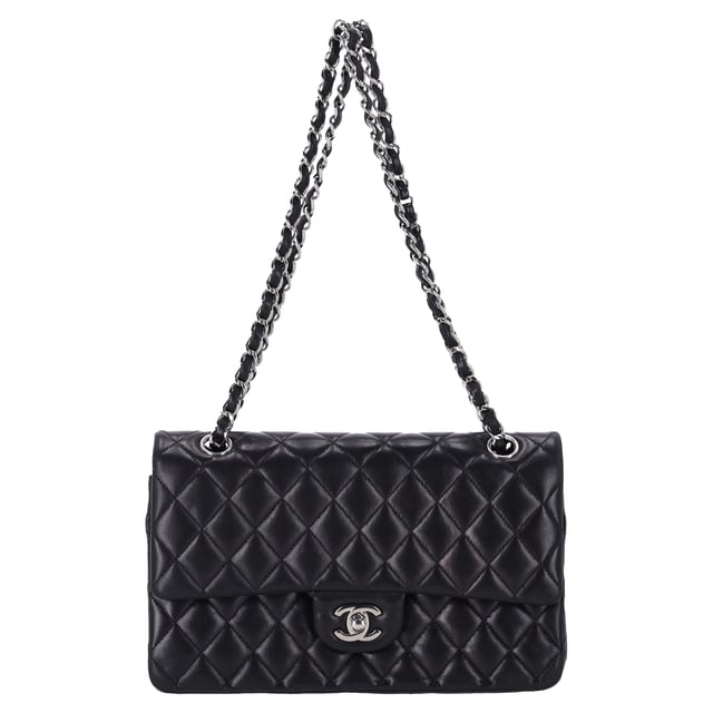 VINTAGE, RRP AS NEW
The Chanel Classic Medium Double Flap Shoulder Bag in Black Lamb Leather is an iconic piece that epitomizes timeless elegance and luxury. Crafted from soft, supple black lamb leather, this bag features the signature quilted design and the classic gold-tone interlocking CC logo on the front. The double flap opens to reveal a luxurious interior, with ample space for your essentials, while the chain-link strap allows for versatile wear—either as a shoulder bag or crossbody.

Styling Tip:
Pair this stunning bag with a little black dress for a sophisticated, evening-ready look that exudes classic Chanel elegance. It also complements tailored suits or a sleek blazer and jeans combo, adding a touch of refinement to your everyday outfit. For a chic daytime ensemble, carry it with a simple blouse, high-waisted trousers, and ballet flats. The black lamb leather and iconic design make it a versatile accessory that can elevate both casual and formal looks, making it an investment piece that adds luxury and style to any occasion.

Chanel Classic Medium Double Flap Shoulder Bag in Black Lamb Leather

Condition: Excellent
Signs of wear: No visible sign of wear., 
Packaging: None
Color: Black
Material: Leather | lambskin leather
Size: One Size | One Size
Measurements: Width: 60; Height: 160; Length: 250
SKU: NAPPUFRBA454378W