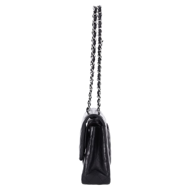VINTAGE, RRP AS NEW
The Chanel Classic Medium Double Flap Shoulder Bag in Black Lamb Leather is an iconic piece that epitomizes timeless elegance and luxury. Crafted from soft, supple black lamb leather, this bag features the signature quilted design and the classic gold-tone interlocking CC logo on the front. The double flap opens to reveal a luxurious interior, with ample space for your essentials, while the chain-link strap allows for versatile wear—either as a shoulder bag or crossbody.

Styling Tip:
Pair this stunning bag with a little black dress for a sophisticated, evening-ready look that exudes classic Chanel elegance. It also complements tailored suits or a sleek blazer and jeans combo, adding a touch of refinement to your everyday outfit. For a chic daytime ensemble, carry it with a simple blouse, high-waisted trousers, and ballet flats. The black lamb leather and iconic design make it a versatile accessory that can elevate both casual and formal looks, making it an investment piece that adds luxury and style to any occasion.

Chanel Classic Medium Double Flap Shoulder Bag in Black Lamb Leather

Condition: Excellent
Signs of wear: No visible sign of wear., 
Packaging: None
Color: Black
Material: Leather | lambskin leather
Size: One Size | One Size
Measurements: Width: 60; Height: 160; Length: 250
SKU: NAPPUFRBA454378W