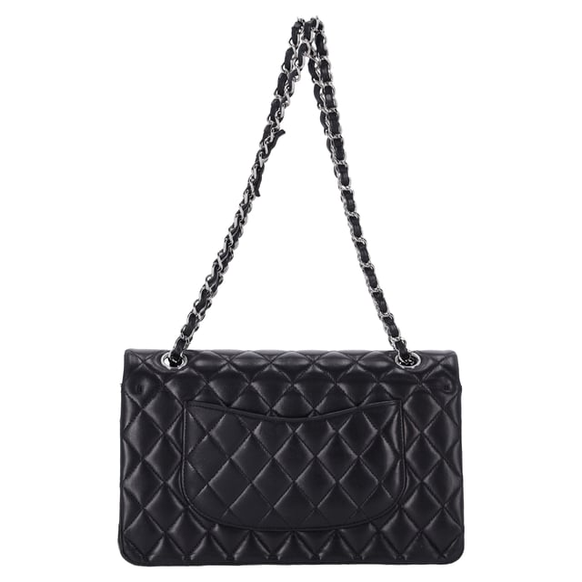 VINTAGE, RRP AS NEW
The Chanel Classic Medium Double Flap Shoulder Bag in Black Lamb Leather is an iconic piece that epitomizes timeless elegance and luxury. Crafted from soft, supple black lamb leather, this bag features the signature quilted design and the classic gold-tone interlocking CC logo on the front. The double flap opens to reveal a luxurious interior, with ample space for your essentials, while the chain-link strap allows for versatile wear—either as a shoulder bag or crossbody.

Styling Tip:
Pair this stunning bag with a little black dress for a sophisticated, evening-ready look that exudes classic Chanel elegance. It also complements tailored suits or a sleek blazer and jeans combo, adding a touch of refinement to your everyday outfit. For a chic daytime ensemble, carry it with a simple blouse, high-waisted trousers, and ballet flats. The black lamb leather and iconic design make it a versatile accessory that can elevate both casual and formal looks, making it an investment piece that adds luxury and style to any occasion.

Chanel Classic Medium Double Flap Shoulder Bag in Black Lamb Leather

Condition: Excellent
Signs of wear: No visible sign of wear., 
Packaging: None
Color: Black
Material: Leather | lambskin leather
Size: One Size | One Size
Measurements: Width: 60; Height: 160; Length: 250
SKU: NAPPUFRBA454378W