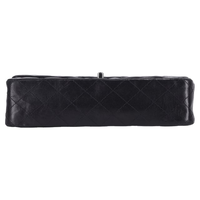 VINTAGE, RRP AS NEW
The Chanel Classic Medium Double Flap Shoulder Bag in Black Lamb Leather is an iconic piece that epitomizes timeless elegance and luxury. Crafted from soft, supple black lamb leather, this bag features the signature quilted design and the classic gold-tone interlocking CC logo on the front. The double flap opens to reveal a luxurious interior, with ample space for your essentials, while the chain-link strap allows for versatile wear—either as a shoulder bag or crossbody.

Styling Tip:
Pair this stunning bag with a little black dress for a sophisticated, evening-ready look that exudes classic Chanel elegance. It also complements tailored suits or a sleek blazer and jeans combo, adding a touch of refinement to your everyday outfit. For a chic daytime ensemble, carry it with a simple blouse, high-waisted trousers, and ballet flats. The black lamb leather and iconic design make it a versatile accessory that can elevate both casual and formal looks, making it an investment piece that adds luxury and style to any occasion.

Chanel Classic Medium Double Flap Shoulder Bag in Black Lamb Leather

Condition: Excellent
Signs of wear: No visible sign of wear., 
Packaging: None
Color: Black
Material: Leather | lambskin leather
Size: One Size | One Size
Measurements: Width: 60; Height: 160; Length: 250
SKU: NAPPUFRBA454378W