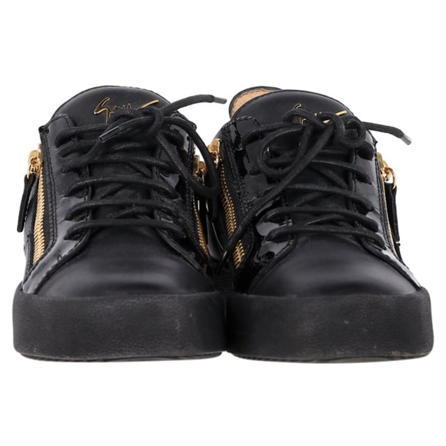 VINTAGE, RRP AS NEW
The Giuseppe Zanotti Frankie Zipper Detail Sneakers in black leather redefine casual luxury with their sleek, modern design. Crafted from premium leather, these sneakers feature bold zipper details that add a distinctive edge to the classic low-top silhouette. The contrasting metallic hardware and signature Zanotti logo elevate the style, making these sneakers the perfect fusion of comfort and high fashion. Ideal for both streetwear enthusiasts and sneaker collectors, they offer versatile wear for any occasion.

Styling Tip: Pair these edgy sneakers with distressed jeans and a graphic tee for a cool, laid-back vibe. For a more refined look, wear them with slim-fit trousers and a leather jacket, balancing the sporty design with sophisticated touches for a fashion-forward street style.

 Giuseppe Zanotti Frankie Zipper Detail Sneakers in Black Leather

Condition: Excellent
Signs of wear: Include Box., No visible sign of wear. No Mark at insole.,  Very light mark at soles.
Packaging: Box, Dust bag
Color: Black
Material: Leather | leather
Size: IT | 39.5
Measurements: Heel height: 30; Insole length: 280
SKU: TONPUGBSH457072W