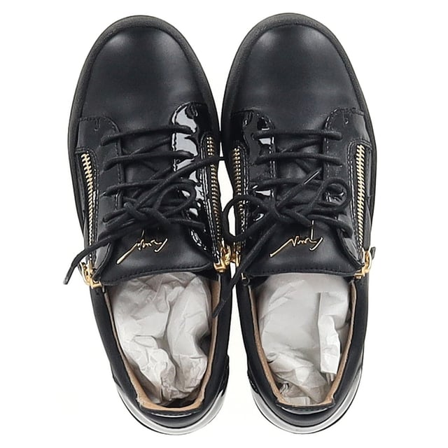 VINTAGE, RRP AS NEW
The Giuseppe Zanotti Frankie Zipper Detail Sneakers in black leather redefine casual luxury with their sleek, modern design. Crafted from premium leather, these sneakers feature bold zipper details that add a distinctive edge to the classic low-top silhouette. The contrasting metallic hardware and signature Zanotti logo elevate the style, making these sneakers the perfect fusion of comfort and high fashion. Ideal for both streetwear enthusiasts and sneaker collectors, they offer versatile wear for any occasion.

Styling Tip: Pair these edgy sneakers with distressed jeans and a graphic tee for a cool, laid-back vibe. For a more refined look, wear them with slim-fit trousers and a leather jacket, balancing the sporty design with sophisticated touches for a fashion-forward street style.

 Giuseppe Zanotti Frankie Zipper Detail Sneakers in Black Leather

Condition: Excellent
Signs of wear: Include Box., No visible sign of wear. No Mark at insole.,  Very light mark at soles.
Packaging: Box, Dust bag
Color: Black
Material: Leather | leather
Size: IT | 39.5
Measurements: Heel height: 30; Insole length: 280
SKU: TONPUGBSH457072W
