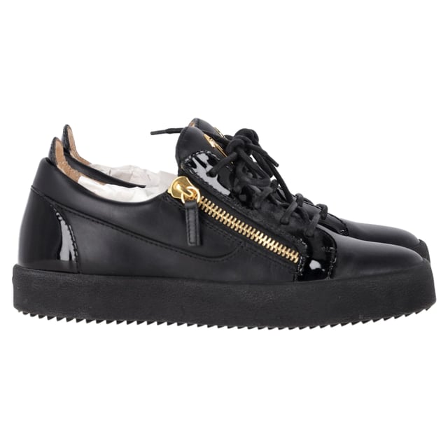 VINTAGE, RRP AS NEW
The Giuseppe Zanotti Frankie Zipper Detail Sneakers in black leather redefine casual luxury with their sleek, modern design. Crafted from premium leather, these sneakers feature bold zipper details that add a distinctive edge to the classic low-top silhouette. The contrasting metallic hardware and signature Zanotti logo elevate the style, making these sneakers the perfect fusion of comfort and high fashion. Ideal for both streetwear enthusiasts and sneaker collectors, they offer versatile wear for any occasion.

Styling Tip: Pair these edgy sneakers with distressed jeans and a graphic tee for a cool, laid-back vibe. For a more refined look, wear them with slim-fit trousers and a leather jacket, balancing the sporty design with sophisticated touches for a fashion-forward street style.

 Giuseppe Zanotti Frankie Zipper Detail Sneakers in Black Leather

Condition: Excellent
Signs of wear: Include Box., No visible sign of wear. No Mark at insole.,  Very light mark at soles.
Packaging: Box, Dust bag
Color: Black
Material: Leather | leather
Size: IT | 39.5
Measurements: Heel height: 30; Insole length: 280
SKU: TONPUGBSH457072W