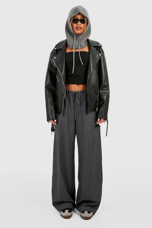 Oversized silhouette for a bold, contemporary look
        Belted design for adjustable fit and added style
        Classic biker jacket details including lapels and asymmetric zip
        Multiple functional pockets for practicality
        Versatile PU fabric suitable for various occasions
    
    Make a statement with this oversized belted biker jacket, a must-have piece for the fashion-forward woman. The relaxed fit offers comfort and style, while the belt allows you to customise the silhouette to your liking. Perfect for casual outings, this jacket pairs effortlessly with wide-leg trousers and a crop top for a trendy ensemble. Layer it over a hoodie and leggings for a laid-back weekend look, or throw it on over a midi dress for an edgy contrast. The multiple pockets add functionality, making it ideal for days out with friends or family gatherings. Whether you're heading to a casual dinner or a night out, this versatile jacket will keep you looking chic and feeling confident in true Boohoo style.