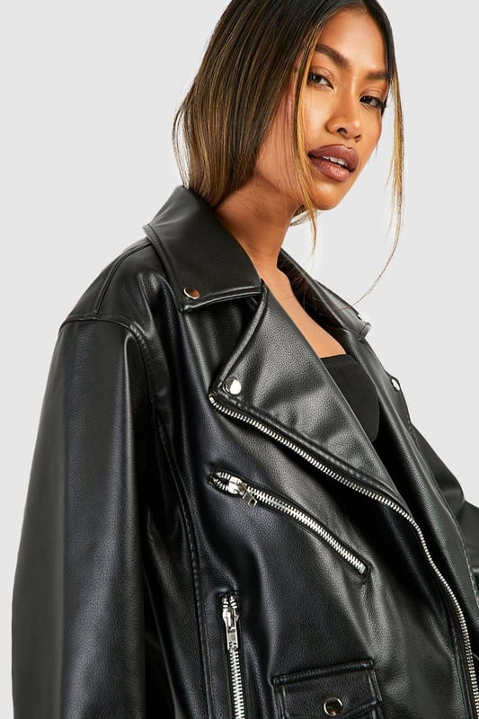 Oversized silhouette for a bold, contemporary look
        Belted design for adjustable fit and added style
        Classic biker jacket details including lapels and asymmetric zip
        Multiple functional pockets for practicality
        Versatile PU fabric suitable for various occasions
    
    Make a statement with this oversized belted biker jacket, a must-have piece for the fashion-forward woman. The relaxed fit offers comfort and style, while the belt allows you to customise the silhouette to your liking. Perfect for casual outings, this jacket pairs effortlessly with wide-leg trousers and a crop top for a trendy ensemble. Layer it over a hoodie and leggings for a laid-back weekend look, or throw it on over a midi dress for an edgy contrast. The multiple pockets add functionality, making it ideal for days out with friends or family gatherings. Whether you're heading to a casual dinner or a night out, this versatile jacket will keep you looking chic and feeling confident in true Boohoo style.