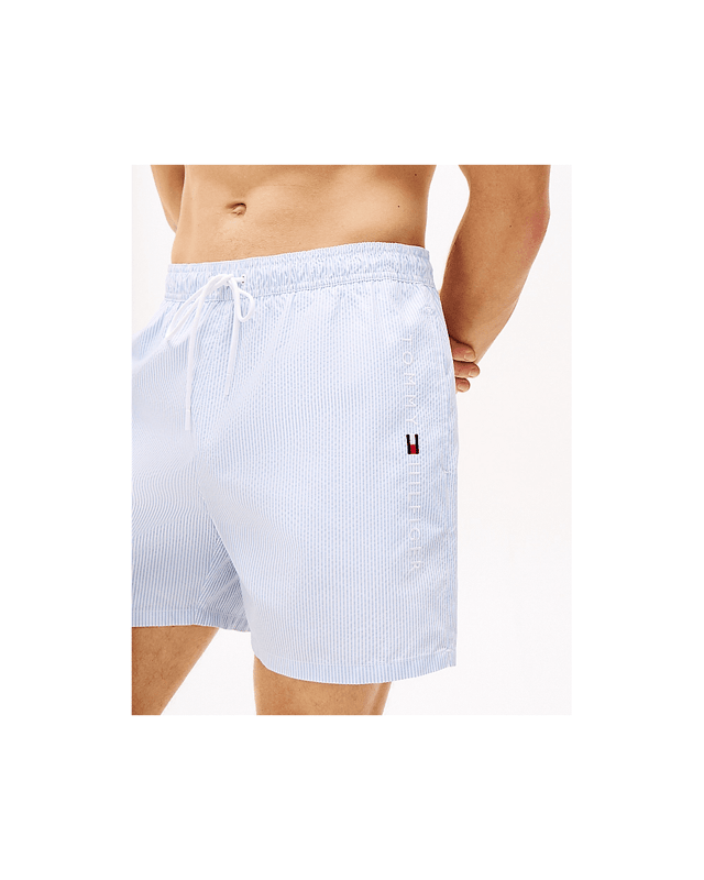 Tommy Hilfiger Medium Drawstring Stripe Mens Swim Shorts Bring retro seaside styling to your swimwear collection with these mid-length swim shorts, designed to showcase the Ithaca stripe.
Highlights
• Recycled polyester swim fabric
• All-over Ithaca stripe
• Elasticated drawstring waist
• Two waist slip pockets
• Mesh lining
• Tommy Hilfiger logo on side
• Tommy Hilfiger branding
Shape & fit
• Classic fit
• Inseam 12.5cm, Outseam 40.5cm
Composition & care
• 100% recycled polyester
UM0UM03265