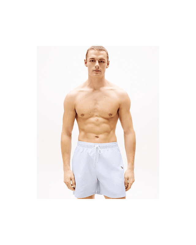 Tommy Hilfiger Medium Drawstring Stripe Mens Swim Shorts Bring retro seaside styling to your swimwear collection with these mid-length swim shorts, designed to showcase the Ithaca stripe.
Highlights
• Recycled polyester swim fabric
• All-over Ithaca stripe
• Elasticated drawstring waist
• Two waist slip pockets
• Mesh lining
• Tommy Hilfiger logo on side
• Tommy Hilfiger branding
Shape & fit
• Classic fit
• Inseam 12.5cm, Outseam 40.5cm
Composition & care
• 100% recycled polyester
UM0UM03265