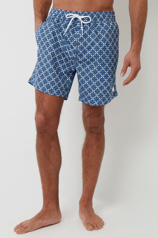 Stock up on your holiday must-haves with this two-pack of swim shorts from Threadbare, an essential to keep you looking and feeling cool in the warm weather. These swimshorts have a lightweight mesh lining and are made from 100% recycled polyester. With an elasticated waistband with drawcords, side pockets, a back welt pocket with hook-and-loop fastening, and finished with our branded rubber badge on the hem. Swimming at the pool or relaxing on the beach, these shorts are for you.