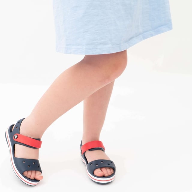 Crocs 12856-485 CROCBAND SANDAL Kids Sandals Navy/Red

 Upper Material: Synthetic

Lining Material: Synthetic

Sole Material: Synthetic

Closure/Fastening: Touch Fasten

Features: Lightweight

Toe Shape: Round

Shoe Width: Regular

Item Weight: 0.29 KG

Heel Height: Flat (Under 2.5cm)

Shoe Shaft Height: Low Top

Sandal Style: Sandals

Gift Boxed: No
Product Code: 12856-485