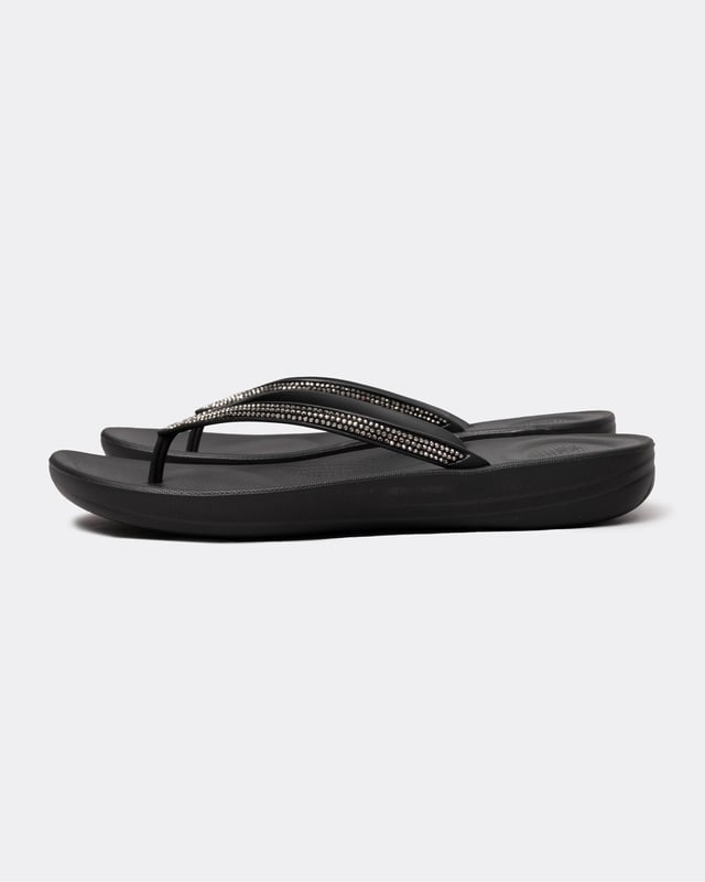 From the top, they look like your typical surfer-girl flip flops. Underneath, they’re engineered with iQushion™ air-foam cushioning, with impact pillows at high pressure areas, for non-stop comfort. These sparkly flip flops are adorned with micro-'crystals', throw a pair in your suitcase and you’ll find yourself wearing them to beach, bar and beyond. Waterproof and slip-resistant.Because of the design of this version, iQushion charms do not fit on these flip-flops.Sizing note: These iQushion flip-flops fit slightly small. If you fit between sizes, we recommend that you go up in size rather than down.
Upper Material:RubberLining Material:UnlinedFastening:Slip-OnOutsole:EVATechnology:iQushion
R08
 