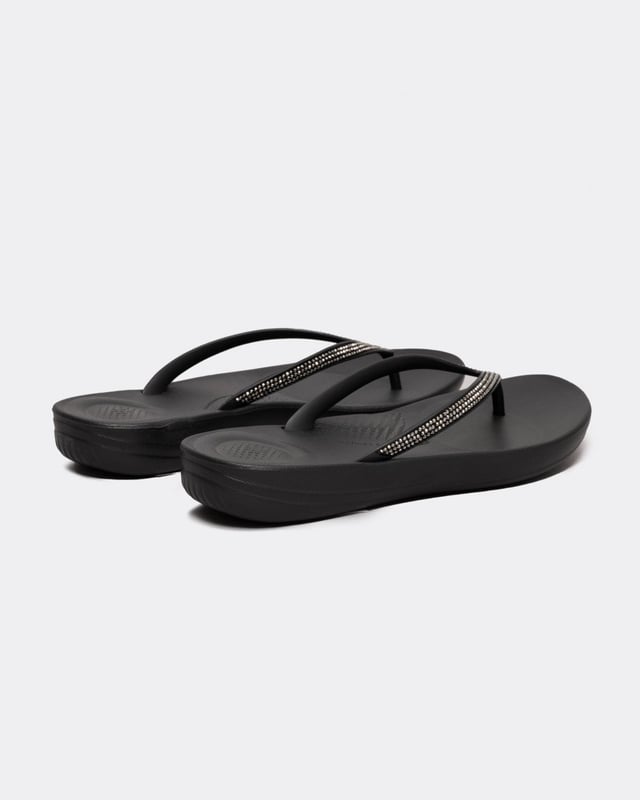 From the top, they look like your typical surfer-girl flip flops. Underneath, they’re engineered with iQushion™ air-foam cushioning, with impact pillows at high pressure areas, for non-stop comfort. These sparkly flip flops are adorned with micro-'crystals', throw a pair in your suitcase and you’ll find yourself wearing them to beach, bar and beyond. Waterproof and slip-resistant.Because of the design of this version, iQushion charms do not fit on these flip-flops.Sizing note: These iQushion flip-flops fit slightly small. If you fit between sizes, we recommend that you go up in size rather than down.
Upper Material:RubberLining Material:UnlinedFastening:Slip-OnOutsole:EVATechnology:iQushion
R08
 
