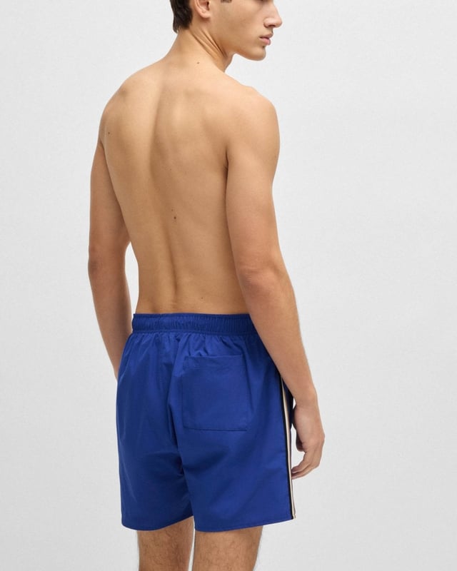 Fully lined swim shorts by BOSS, detailed with signature stripes and a logo.
100% Polyester (recycled) , Lining: 100% Polyester
50491594