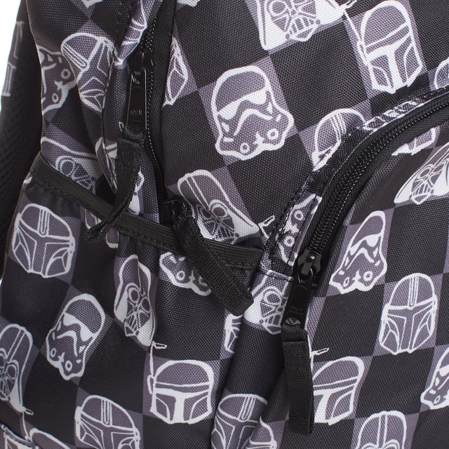 Children's backpack with a Star Wars graphic print, made with 70% recycled polyester to reduce waste and contribute to caring for the environment.

 This design combines style and functionality, with a durable fabric ideal for everyday use.

 It features a large main compartment with a zipper, specific internal space for a computer or tablet, and a front zippered compartment for quick access.

 Fits A4 format.

 Includes two side pockets perfect for carrying bottles, adjustable straps for a comfortable fit and a top handle for hand carrying.

 In addition, it has an internal name tag, allowing it to be easily personalized.

 A complete and sustainable accessory to accompany little Star Wars fans on their daily adventures.
 Measures: 39 x 30.5 x 16.5 cm
 Composition: Body: 100% Polyester; Lining: 100% Polyester
 Care:
- Clean the backpack with a damp cloth and mild soap.
 - Air dry.