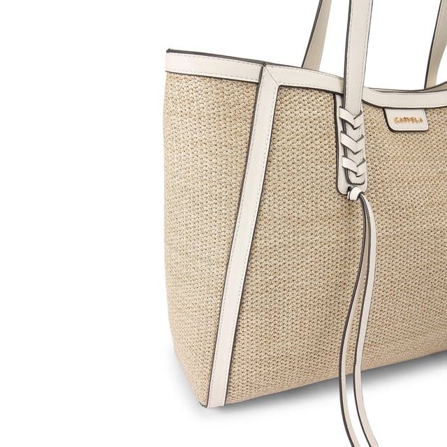 This Kurt Geiger Tassel Winged Tote bag features a natural woven raffia exterior with a small gold branding detail on the front. Each shoulder strap is accented with a braided tassel detail. Dimensions: 31cm (H), 39cm (L), 12cm (D). Strap length: 64cm.