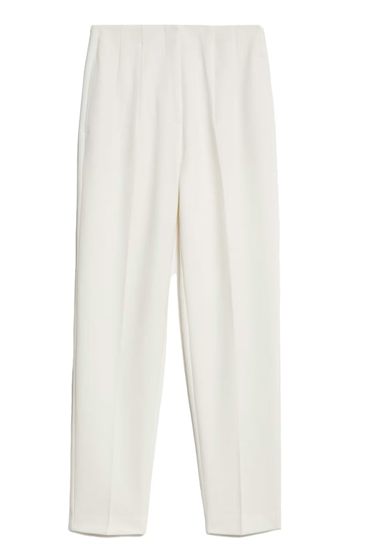 These trousers offer easy wear for smart and casual occasions alike. They have tapered legs with added stretch for comfort and an ankle-grazer length for a contemporary look. The elasticated high waist features double darts for a tailored effect and fastens securely with a hook bar and zip with a concealed button