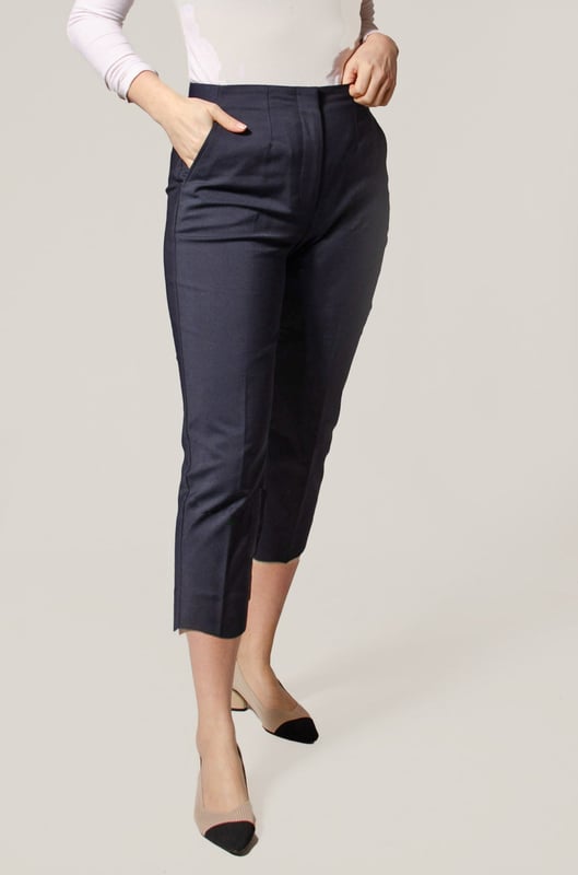 These trousers offer easy wear for smart and casual occasions alike. They have tapered legs with added stretch for comfort and an ankle-grazer length for a contemporary look. The elasticated high waist features double darts for a tailored effect and fastens securely with a hook bar and zip with a concealed button