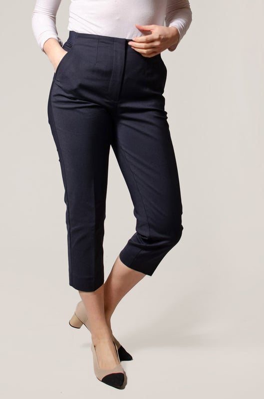 These trousers offer easy wear for smart and casual occasions alike. They have tapered legs with added stretch for comfort and an ankle-grazer length for a contemporary look. The elasticated high waist features double darts for a tailored effect and fastens securely with a hook bar and zip with a concealed button
