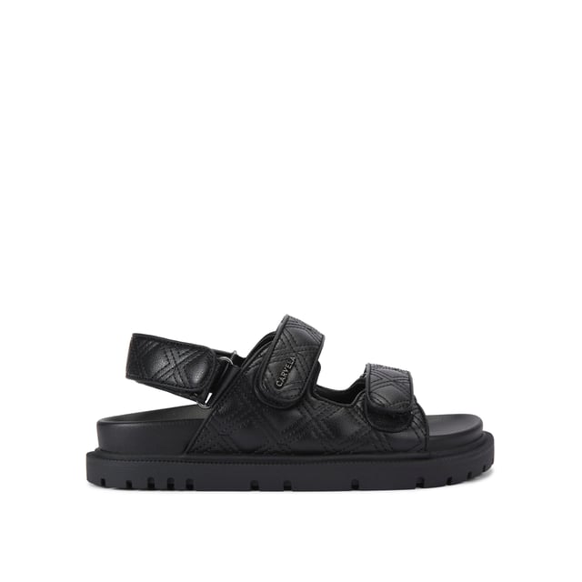 The Carvela Rosa Sandal is crafted in a black leather alternative. There is overstitch quilting in a diamond style across the upper straps. There is a gunmetal branding detail on the top strap.