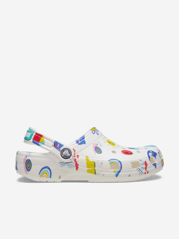 Introducing the Kids Classic Doodle Print Clog in White from Crocs, the perfect stylish and comfortable footwear choice for your child for AW2024. Here's why it's a must-have:‚Unique Doodle Design: Features fun  creative prints that pop against the classic white backdrop.‚Supreme Comfort: Crafted with Crocs‚ iconic Croslite‚ foam, offering a cushiony ride all day long.‚Versatile Wear: Ideal for both indoor Cosiness and outdoor adventures.‚Easy to Clean: Just soap and water, and they're ready for the next playful day.Step up your child‚ style game with these trendy clogs! Order now!
