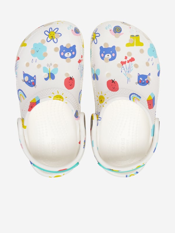 Introducing the Kids Classic Doodle Print Clog in White from Crocs, the perfect stylish and comfortable footwear choice for your child for AW2024. Here's why it's a must-have:‚Unique Doodle Design: Features fun  creative prints that pop against the classic white backdrop.‚Supreme Comfort: Crafted with Crocs‚ iconic Croslite‚ foam, offering a cushiony ride all day long.‚Versatile Wear: Ideal for both indoor Cosiness and outdoor adventures.‚Easy to Clean: Just soap and water, and they're ready for the next playful day.Step up your child‚ style game with these trendy clogs! Order now!