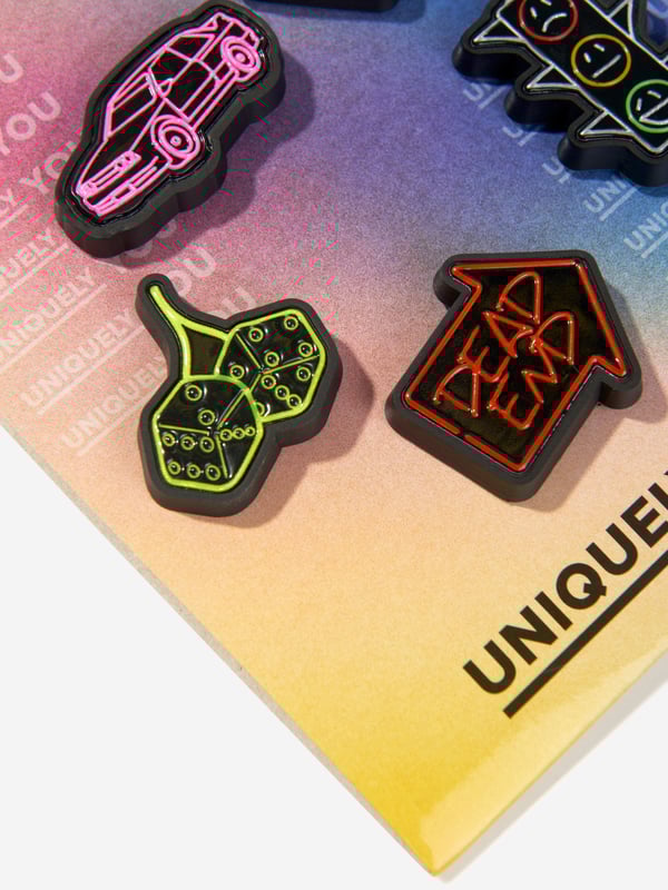 Enhance your urban style with the Reflective Street multi-coloured Jibbitz‚ charms! These sleek accessories add a unique edge to your Crocs with their reflective designs. Easy to use and eye-catching, they are the perfect addition for streetwear enthusiasts. Elevate your footwear with these must-have charms and stand out on the streets!

NOTE: Sold Separately to Shoe

‚Not a Toy
‚Not Intended For Children Under 3 Years Of Age