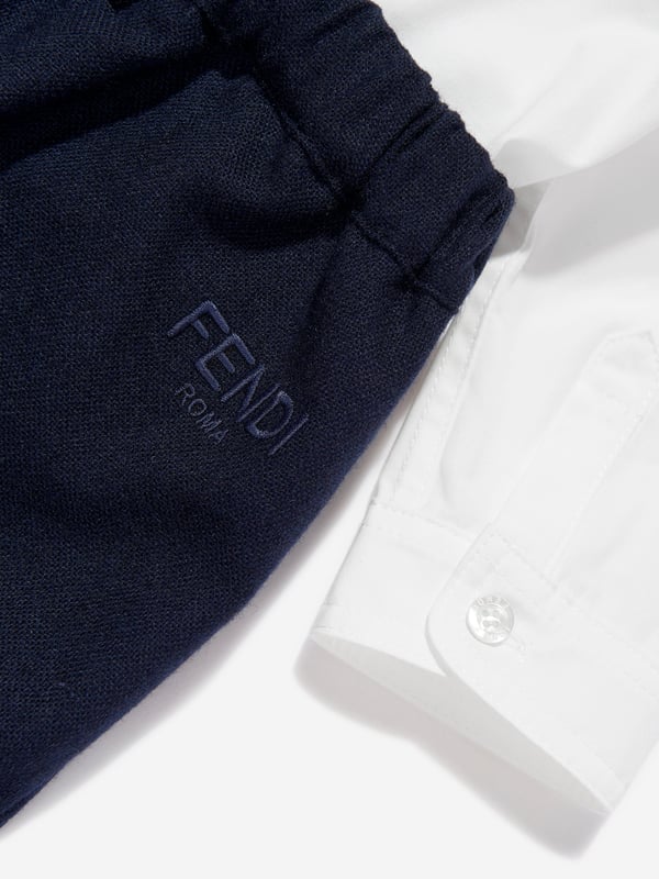 Discover the Fendi Kids' Baby Boys Short Poplin Romper in Navy, a luxurious addition to the young gentleman‚ wardrobe for AW2024. Made in Italy, this romper showcases meticulous craftsmanship and rich, vibrant blue poplin, ideal for stylish comfort. Here‚ why it‚ a season must-have:‚Exquisite Italian Craftsmanship: Tailored in Italy, ensuring top-notch quality and lasting elegance.‚Comfort Fit: Soft, breathable fabric for all-day comfort.‚Versatile Navy Hue: Perfect for any occasion, seamlessly blending with existing pieces.‚Fendi Charm: Embellished with subtle designer details that echo the iconic Fendi sophistication.Elevate his collection with this timeless romper today!