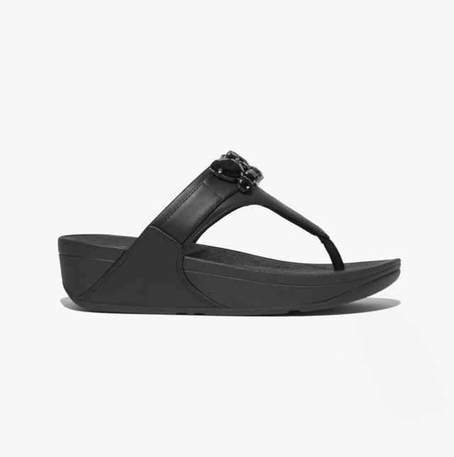 Women's Fit Flop Lulu Bejewelled Trim Toe-Post Sandals in Black It has a soft leather upper and the renowned Fitflop microwobbleboard sole unit with built in arch contour support. This Lulu womens Leather sandal with toe post makes a great everyday flip flopThe leather uppers are super soft and have a breathable microfibre lining which also helps to wick moisture away from the foot whilst the footbed gives good support and comfort for all day wear. The Lulu Leather toe post sandal is a must have comfortable womens lth flip flop for this summer