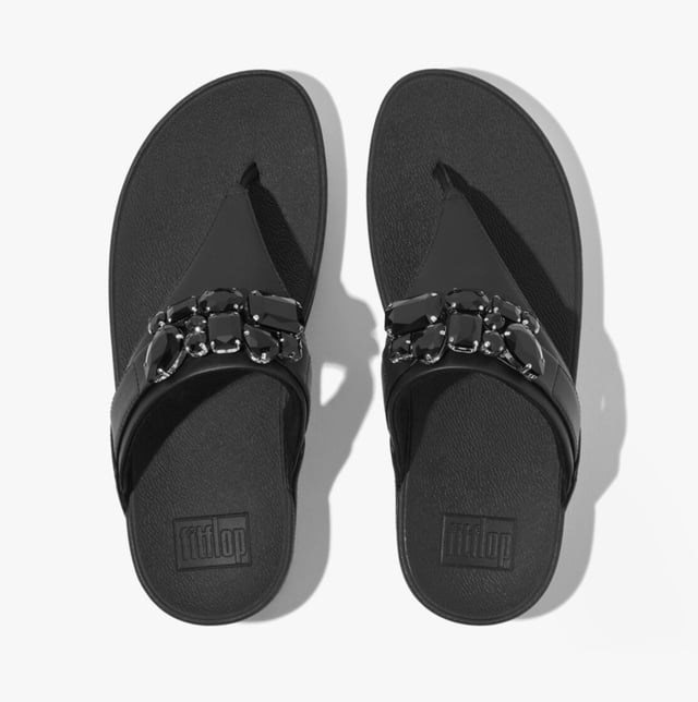 Women's Fit Flop Lulu Bejewelled Trim Toe-Post Sandals in Black It has a soft leather upper and the renowned Fitflop microwobbleboard sole unit with built in arch contour support. This Lulu womens Leather sandal with toe post makes a great everyday flip flopThe leather uppers are super soft and have a breathable microfibre lining which also helps to wick moisture away from the foot whilst the footbed gives good support and comfort for all day wear. The Lulu Leather toe post sandal is a must have comfortable womens lth flip flop for this summer