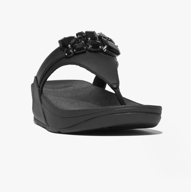 Women's Fit Flop Lulu Bejewelled Trim Toe-Post Sandals in Black It has a soft leather upper and the renowned Fitflop microwobbleboard sole unit with built in arch contour support. This Lulu womens Leather sandal with toe post makes a great everyday flip flopThe leather uppers are super soft and have a breathable microfibre lining which also helps to wick moisture away from the foot whilst the footbed gives good support and comfort for all day wear. The Lulu Leather toe post sandal is a must have comfortable womens lth flip flop for this summer
