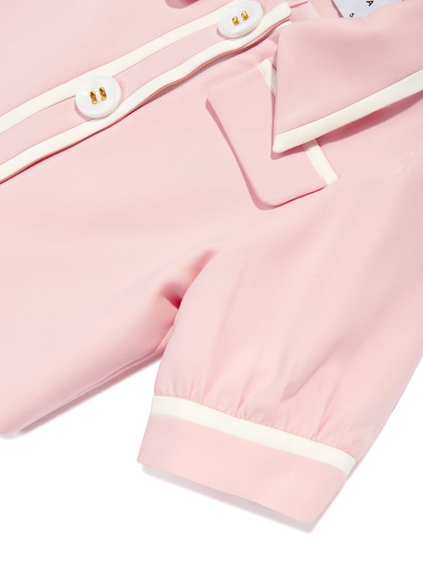 Mama Luma incorporate beautiful eco-friendly materials into their sophisticated handmade constructions. This girls pink shirt jacket is reflective of the Californian label's precision of beauty. It showcases a pointed collar, white trims, short puffy sleeves, large pearlescent buttons and front welt pockets.‚Cotton Lining ‚71% Polyester, 20% Viscose, 9% Elastane