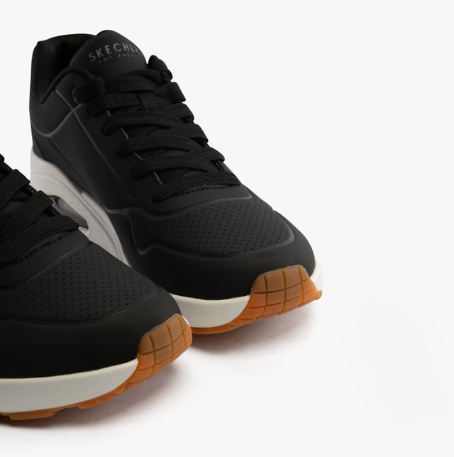 Classic air-cushioned comfort meets a fresh update in the Skechers Street Street Uno - Stand on Air shoe. This lace-up fashion sneaker features a smooth perforated synthetic upper with an Air-Cooled Memory Foam insole and Skech-Air visible air-cushioned midsole.