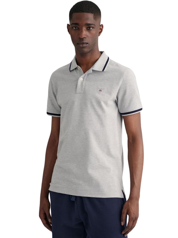 Elevate your wardrobe with our timeless Regular fit Short sleeves cotton piqué shirt. Featuring herringbone detailing on the collar and cuffs and an embroidered GANT shield on the chest, this sporty classic is made of lightweight, breathable fabric (2063005)