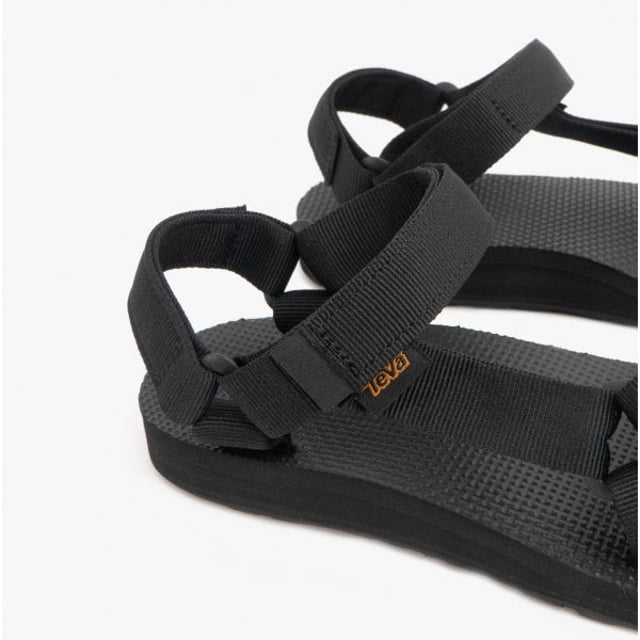 Teva ORIGINAL UNIVERSAL Ladies Sandals Black

 Upper Material: Textile

Sole Material: Synthetic

Closure/Fastening: Slip-On

Features: Lightweight,Vegan,Comfort,Breathable,Adjustable Strap

Toe Shape: Round

Shoe Width: Regular

Item Weight: 0.5 KG

Heel Height: Flat (Under 2.5cm)

Sandal Style: Sandals

Gift Boxed: No
Product Code: 1003987-BLK