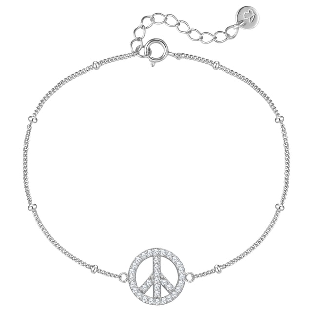 With this magical bracelet from the Glanzstücken München brand you make a clear statement for peace and style. The bracelet is made of high-quality, rhodium-plated 925 sterling silver and impresses with its fine anchor chain structure, which fits harmoniously around your wrist. The absolute eye-catcher is the sparkling peace sign, which is set with countless faceted zirconia and glitters impressively with every ray of light. Thanks to its timeless design, this piece of jewelry goes perfectly with any outfit - whether casual or elegant. Wear the bracelet as a daily companion that not only refines your look, but also conveys a positive message.