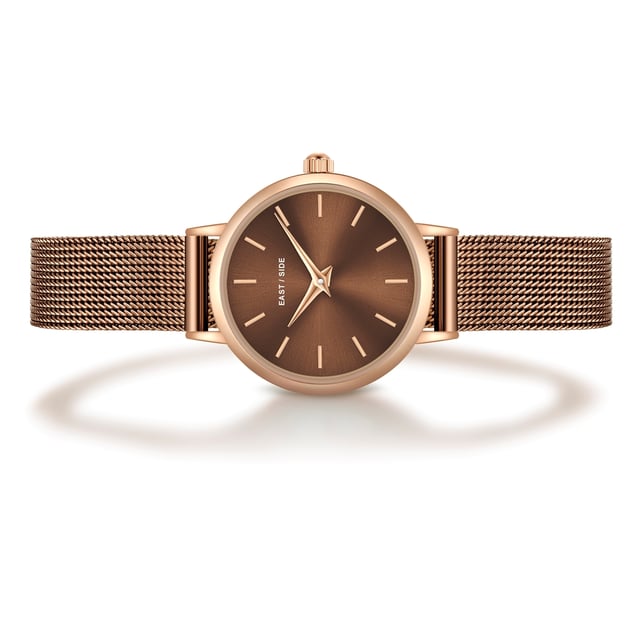 GENERAL INFORMATION:  • Targetgroup: Female  • Wristwatch: No Special Functions  • Display: analogue  • Weight of watch w/o box (gr.) - approx.: 25,0  MOVEMENT:  • Movement: Quartz  • Term of Movement: VC10  • Origin of movement: Japan  BRACELET:  • Material of bracelet/strap: Stainless steel  • Plating of bracelet/strap: Ion-Plating (IP)  • Finishing of bracelet/strap: Smooth  • Finishing/Decoration of bracelet/strap: None  • Clasp/Closure/Buckle: Slide Clasp  • Color of bracelet/strap: Brown  • Length of bracelet/strap (mm) approx.: 190,0  • Width of bracelet/strap (mm) approx.: 9,5  • Style/Design of bracelet/strap: Mesh band (Millanaise Style)  • Bracelet/strap adjustable?: No  CASE:  • Shape of case: Round  • Size/Diameter of case in mm . approx.: 24,0  • Height of case in mm: 7,6  • Case material: Metal (Alloy)  • Surface of case: Polished  • Bezel/Topring: Fixed  • Finishing/Decoration of case: None  • Material of case back: Stainless steel  • Lock of case back: No screwed-in crown  • Color of case: Rosegold  • Coating/Plating (Case): Ion-Plating (IP)  • Type/Form of crystal: Flat  • Material of crystal: Mineral crystal  • Water resistant (ATM): 3  DIAL:  • Size jewelry care cloth: Hour, Minute  • Indices: Line indices  • Material of dial: Brass  • Structure/pattern of dial: Flat  • Color of dial: Brown  PUSHER, CROWN, HAND:  • Pusher: None  • Corrector: No  • Crown: No screwed-in crown  • Type of hands: Dauphine hands  • Luminescent (hands): No  PACKAGING & SCOPE OF DELIVERY:  • Box: Yes  • Service booklet: Yes  • Manual: Yes