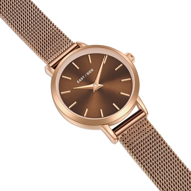 GENERAL INFORMATION:  • Targetgroup: Female  • Wristwatch: No Special Functions  • Display: analogue  • Weight of watch w/o box (gr.) - approx.: 25,0  MOVEMENT:  • Movement: Quartz  • Term of Movement: VC10  • Origin of movement: Japan  BRACELET:  • Material of bracelet/strap: Stainless steel  • Plating of bracelet/strap: Ion-Plating (IP)  • Finishing of bracelet/strap: Smooth  • Finishing/Decoration of bracelet/strap: None  • Clasp/Closure/Buckle: Slide Clasp  • Color of bracelet/strap: Brown  • Length of bracelet/strap (mm) approx.: 190,0  • Width of bracelet/strap (mm) approx.: 9,5  • Style/Design of bracelet/strap: Mesh band (Millanaise Style)  • Bracelet/strap adjustable?: No  CASE:  • Shape of case: Round  • Size/Diameter of case in mm . approx.: 24,0  • Height of case in mm: 7,6  • Case material: Metal (Alloy)  • Surface of case: Polished  • Bezel/Topring: Fixed  • Finishing/Decoration of case: None  • Material of case back: Stainless steel  • Lock of case back: No screwed-in crown  • Color of case: Rosegold  • Coating/Plating (Case): Ion-Plating (IP)  • Type/Form of crystal: Flat  • Material of crystal: Mineral crystal  • Water resistant (ATM): 3  DIAL:  • Size jewelry care cloth: Hour, Minute  • Indices: Line indices  • Material of dial: Brass  • Structure/pattern of dial: Flat  • Color of dial: Brown  PUSHER, CROWN, HAND:  • Pusher: None  • Corrector: No  • Crown: No screwed-in crown  • Type of hands: Dauphine hands  • Luminescent (hands): No  PACKAGING & SCOPE OF DELIVERY:  • Box: Yes  • Service booklet: Yes  • Manual: Yes